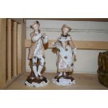 PAIR OF LATE 19TH CENTURY CONTINENTAL PORCELAIN FIGURES OF A GENTLEMAN AND A LADY