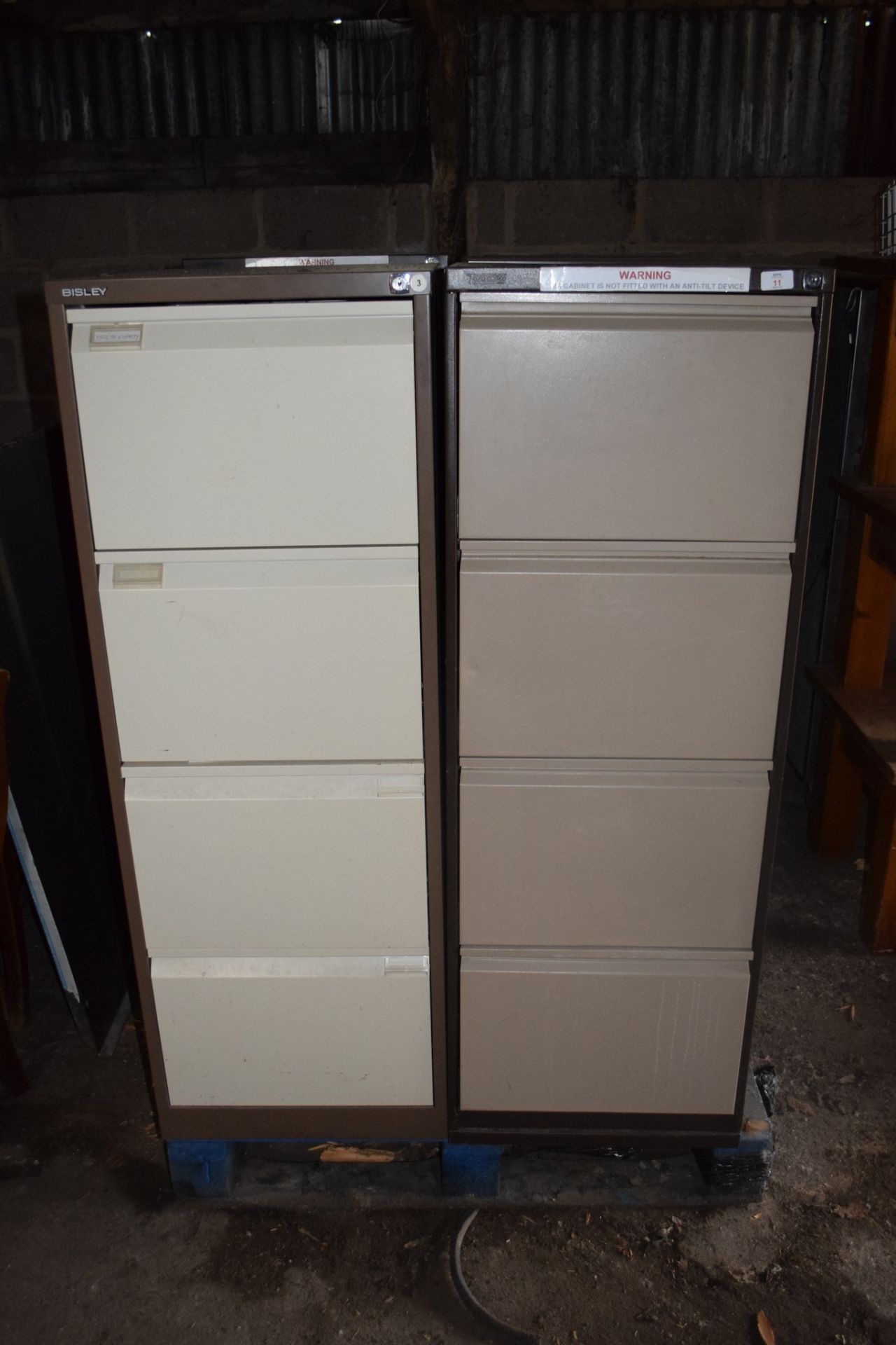 Four four-drawer metal Filing Cabinets.