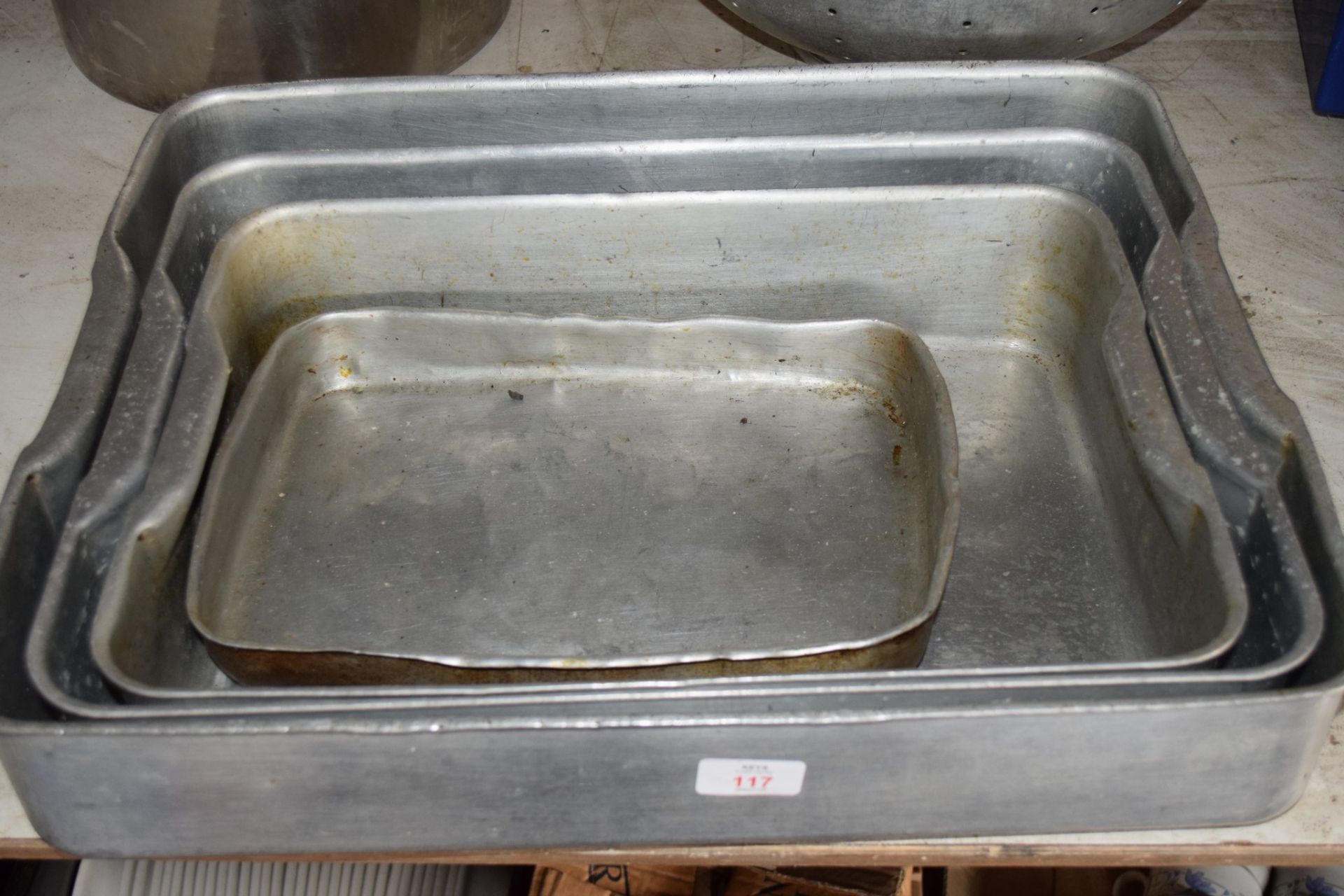 Four variously sized aluminium Baking Trays.