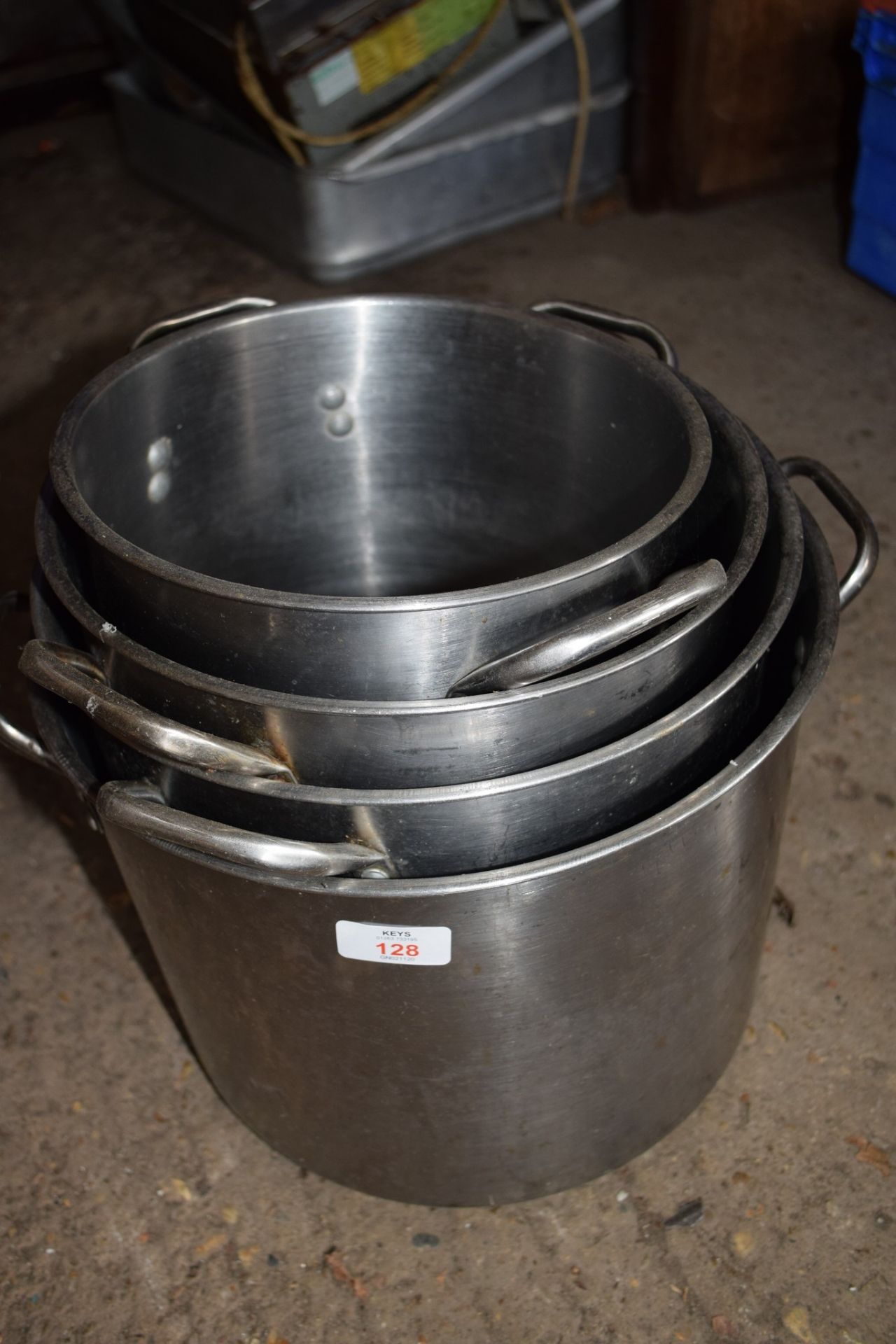 Four various sized stainless steel Cooking Pots.