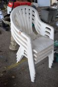 FOUR PLASTIC PATIO CHAIRS