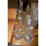 GROUP OF CUT GLASS WARES INCLUDING TWO PLATED CLARET JUGS, VARIOUS DECANTERS ETC