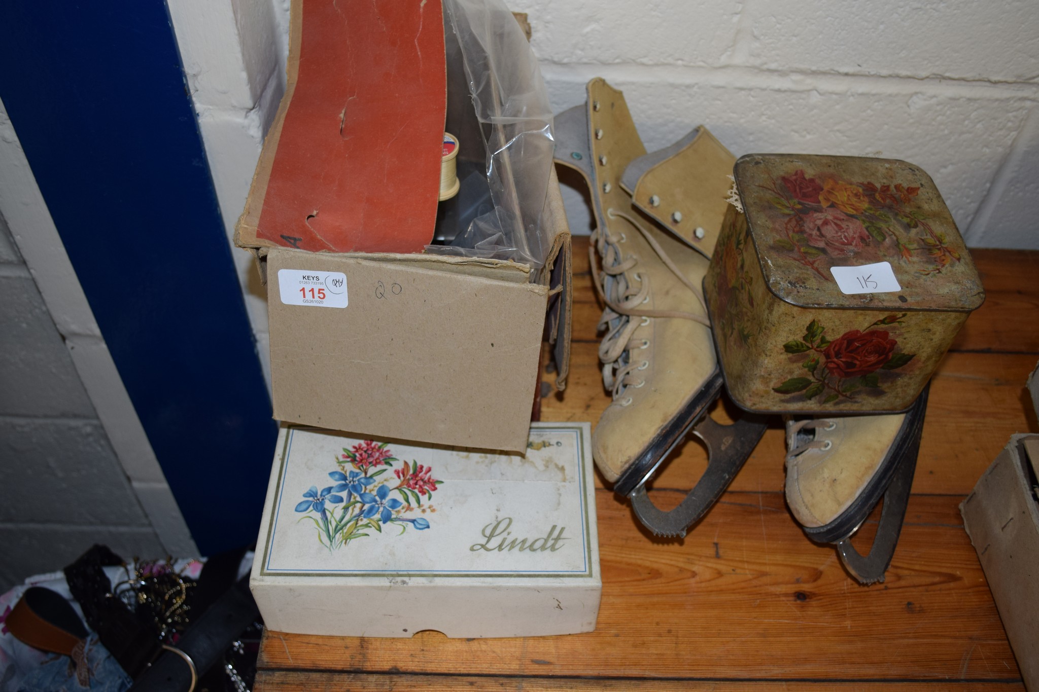 SMALL BOXED SEWING MACHINE WITH VARIOUS BOBBINS ETC AND A PAIR OF SKATING SHOES