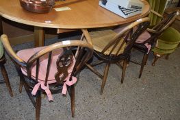 SET OF FOUR ERCOL STYLE WHEEL BACK DINING CHAIRS COMPRISING TWO CARVERS AND TWO SINGLE CHAIRS