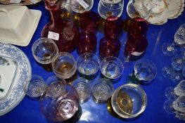 GLASS WARES, CRANBERRY COLOURED WINE GLASSES AND DECANTER