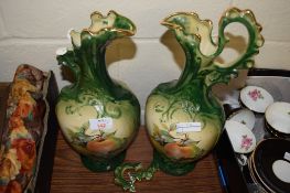 PAIR OF POTTERY EWERS PRINTED WITH FRUIT