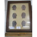 FRAMED SET OF VARIOUS INTAGLIOS IN THE FORM OF CLASSICAL HEADS