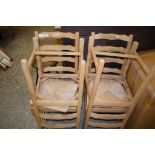 SET OF FOUR PINE SLAT BACK KITCHEN CHAIRS WITH RUSH SEATS