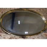 MODERN GILT FRAMED OVAL WALL MIRROR, 70CM WIDE