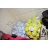 TWO POLYTHENE BAGS CONTAINING GOLF BALLS