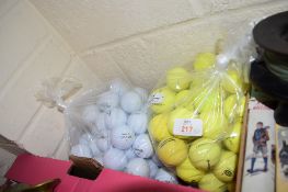 TWO POLYTHENE BAGS CONTAINING GOLF BALLS