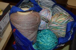 BAG CONTAINING VARIOUS BALLS OF YARN