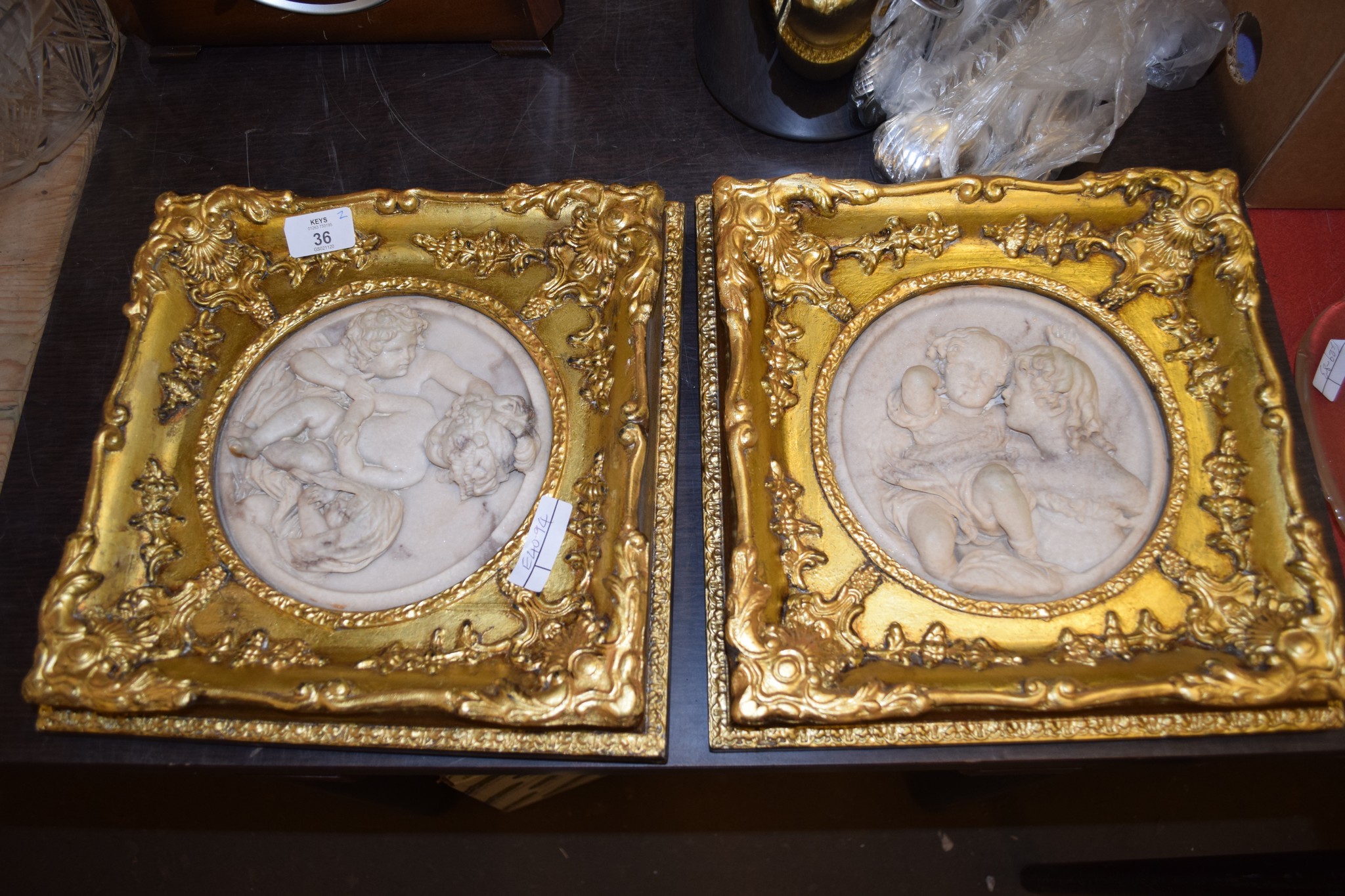 TWO MODERN PARIAN TYPE PLAQUES IN GILT FRAMES