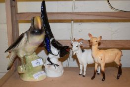 POTTERY MODEL OF A PELICAN, PLUS A MAGPIE AND TWO GOATS, THE GOAT AND A DEER BY ROYAL DOULTON AND