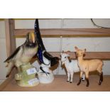 POTTERY MODEL OF A PELICAN, PLUS A MAGPIE AND TWO GOATS, THE GOAT AND A DEER BY ROYAL DOULTON AND
