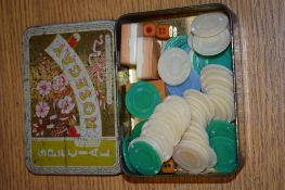 TIN CONTAINING VARIOUS GAMING COUNTERS