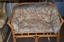 SMALL TWO-SEATER CANE CONSERVATORY SOFA, WIDTH APPROX 126CM