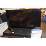 SONY BRAVIA 40” LCD FLAT SCREEN TV, TOGETHER WITH A SONY HOME THEATRE SOUND BAR