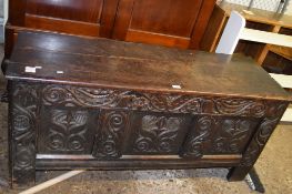 OAK BLANKET CHEST WITH CARVED DECORATION, RAISED ON STILE FEET, LENGTH APPROX 140CM