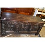 OAK BLANKET CHEST WITH CARVED DECORATION, RAISED ON STILE FEET, LENGTH APPROX 140CM