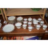 PART POTTERY TEA SERVICE WITH ROSE BORDER