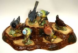 Group of Beswick ware birds mounted on a naturalistic wooden base (6)