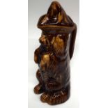 Treacle glazed spaniel character jug with cover, 28cm high