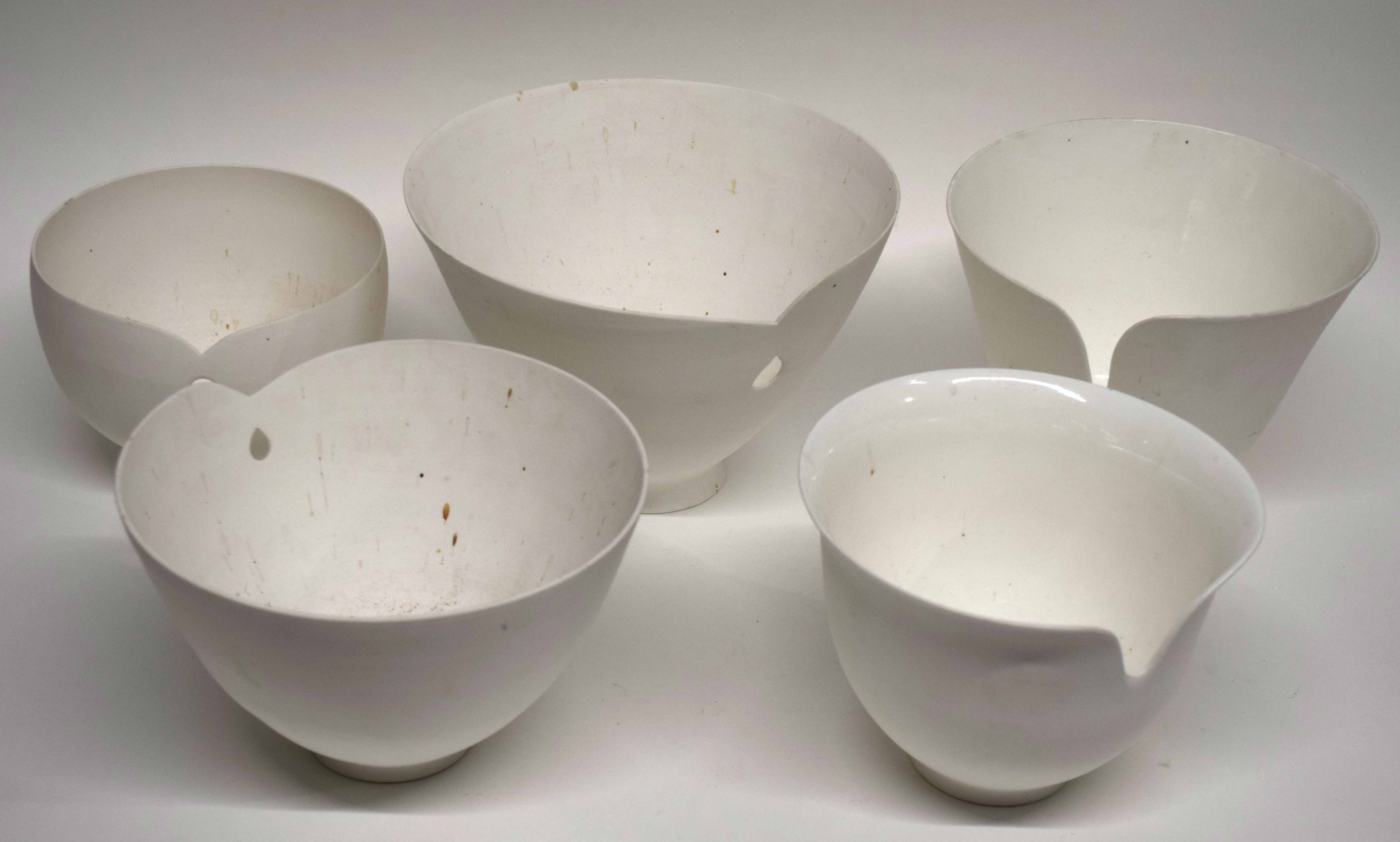 Interesting group of studio pottery bowls modelled in white with a pierced design, the base