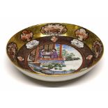 18th century Qianlong period saucer, decorated in polychrome with a Chinese family scene to the