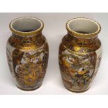 Pair of Japanese Meiji period Satsuma ware vases decorated in typical fashion, 24cm high (2) (