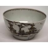 Lowestoft porcelain tea bowl decorated with a sepia pattern of pagodas with wavy line to interior