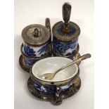 Cruet set and stand with a blue and white design by Davenport including a small silver mustard spoon