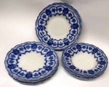 Group of late 19th century bowls and plates, all decorated with a flow blue design by Johnson Bros