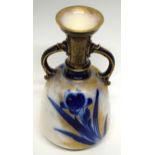 Doulton Burslem vase, late 19th century, the gilt ground with a blue floral design with loop