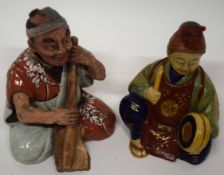 Two porcelain nodding figures of Orientals