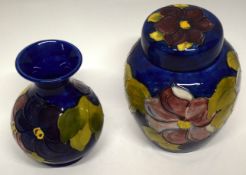 Moorcroft jar and cover with a tube lined floral design and further baluster vase with tube lined