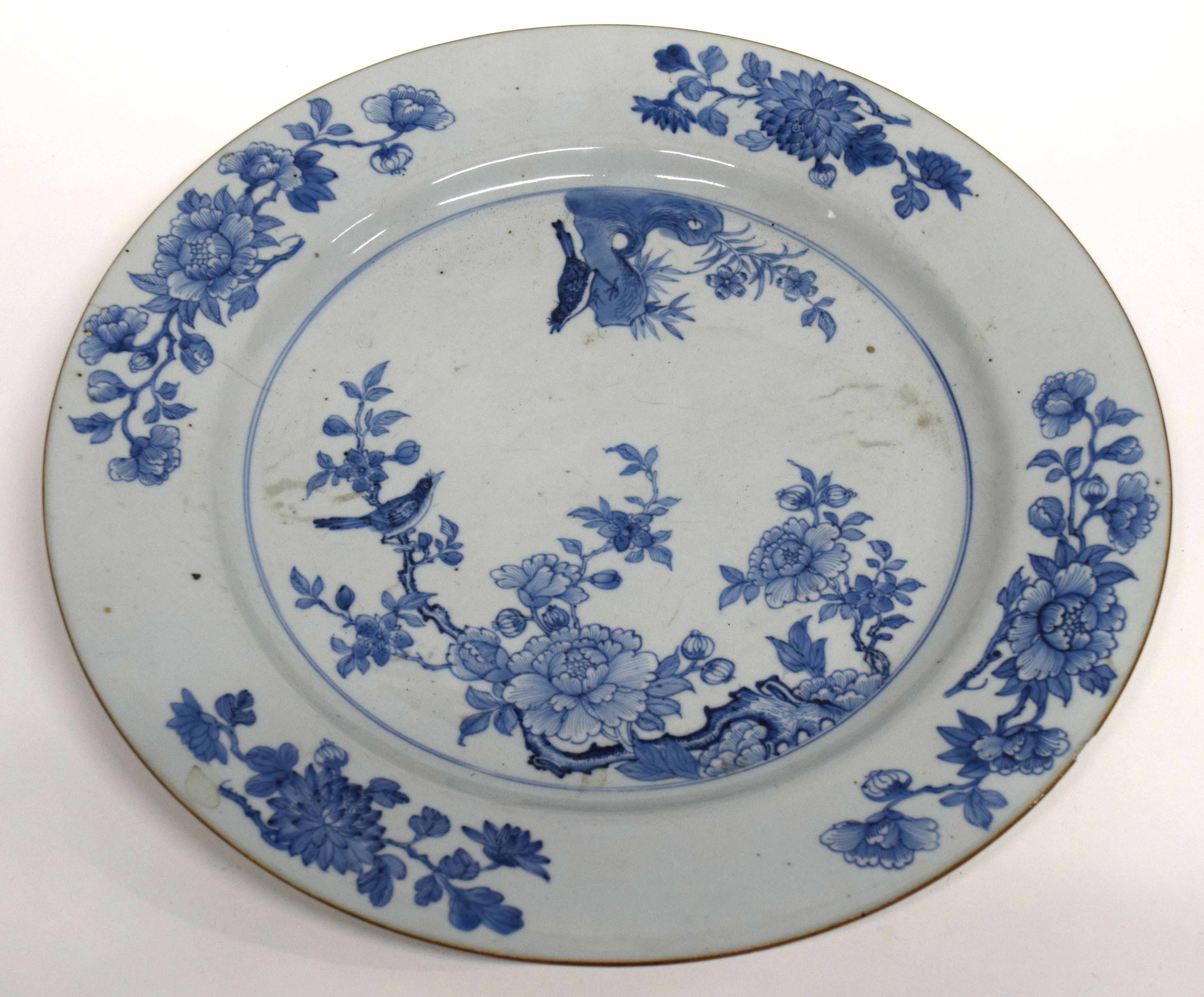 18th century Chinese porcelain Qianlong charger decorated in blue and white with prunus and a bird