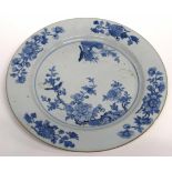 18th century Chinese porcelain Qianlong charger decorated in blue and white with prunus and a bird