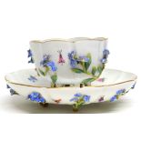 Meissen cup and saucer moulded with flowers and leaves of lobed shape (handle missing)