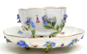 Meissen cup and saucer moulded with flowers and leaves of lobed shape (handle missing)