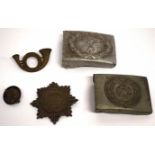 Plastic wallet containing two metal WWII German badges with swastika emblem and further WWII emblems