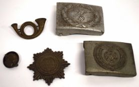 Plastic wallet containing two metal WWII German badges with swastika emblem and further WWII emblems