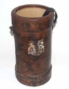 20th century brown leather and canvas cordite bucket/muzzle cover with painted Royal cartouche of