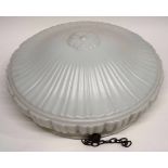 Plastic box containing large white glass shade