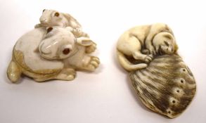 Two finely carved netsuke, in the form of a pair of rabbits