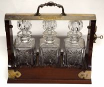 Vintage mahogany cased and silver plated mounted three-bottle tantalus, 34cm wide