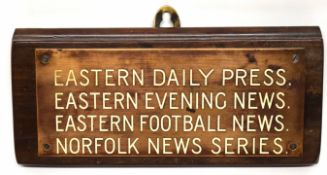 Brass plaque mounted on a wooden base with details of Eastern Daily Press, Eastern Football News,