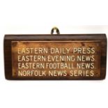 Brass plaque mounted on a wooden base with details of Eastern Daily Press, Eastern Football News,