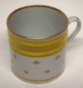 Coalport style coffee can with a yellow and gilt design, height 6cm high