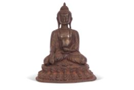 Bronze metal Buddha, Shakayamuni, in traditional pose on raised oval base, 18cm high